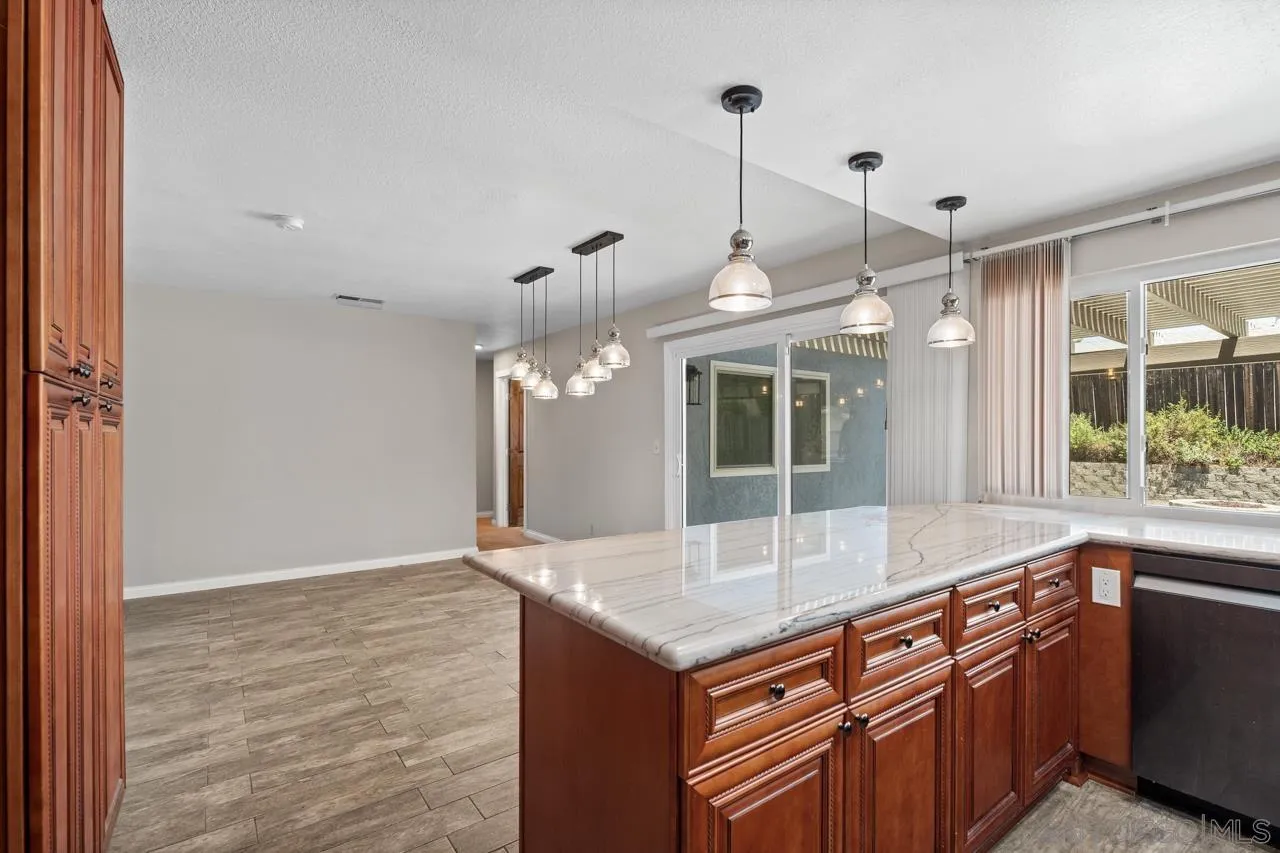 14932 Cinchring Drive Poway, CA 92064 - Photo 6 of 14 a kitchen with granite countertop a oven and a sink with granite countertops