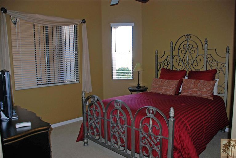 57695 Santa Rosa Trail La Quinta, CA 92253 - Photo 8 of 11 a bedroom with a bed and a window