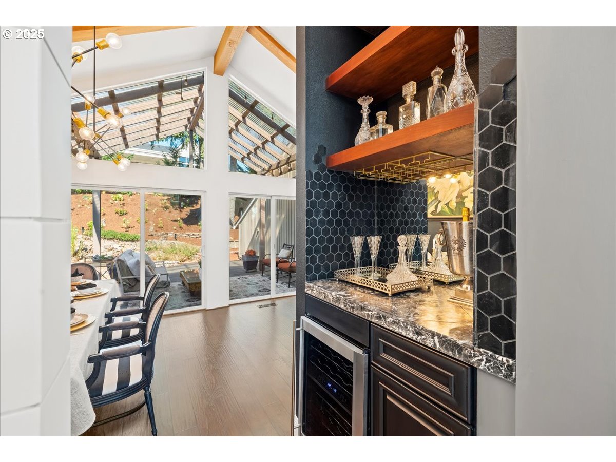 8014 Southeast Middle Way Vancouver, WA 98664 - Photo 13 of 47 a kitchen view of a dining table chairs and chandelier