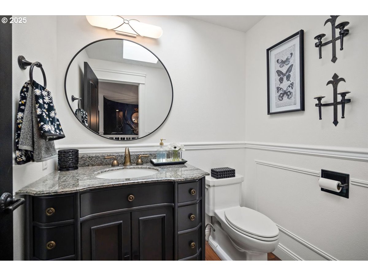 8014 Southeast Middle Way Vancouver, WA 98664 - Photo 22 of 47 a bathroom with a toilet a sink and mirror