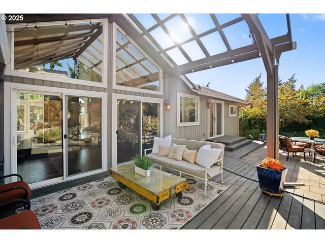 a view of backyard with plants and outdoor seating