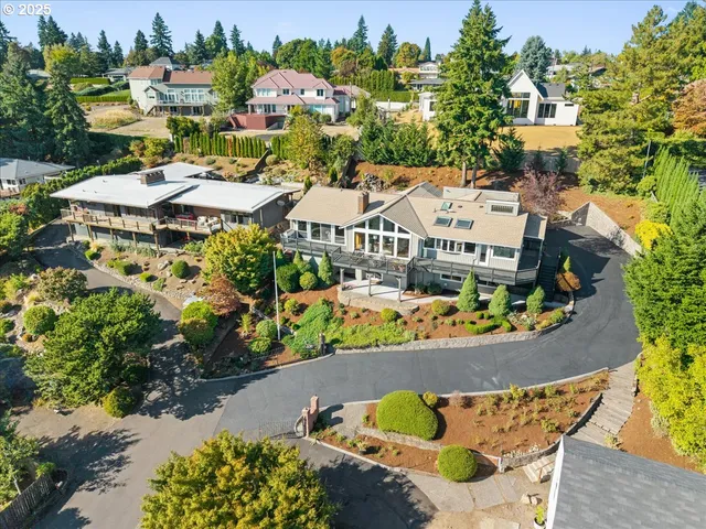 an aerial view of residential house with outdoor space and swimming pool