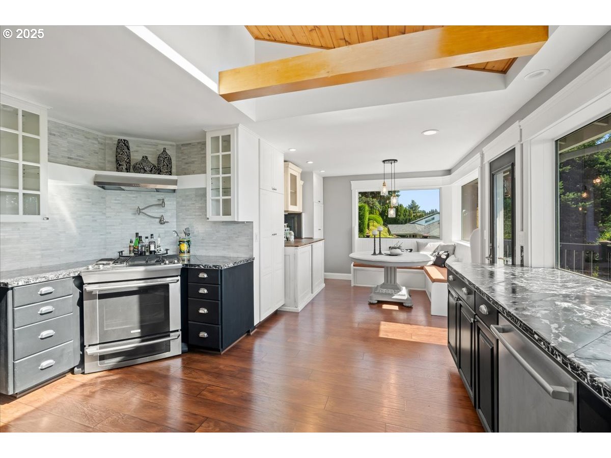 8014 Southeast Middle Way Vancouver, WA 98664 - Photo 9 of 47 a kitchen with sink cabinets and wooden floor