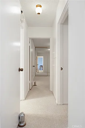 a view of a house with a swimming pool and a yard