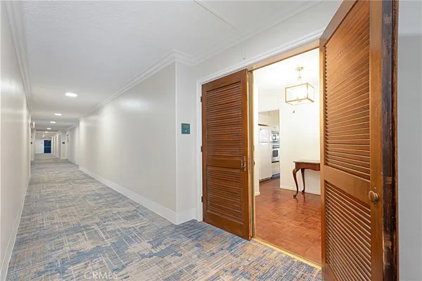 a view of a livingroom with furniture and a kitchen