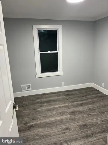 a view of room with hardwood floor