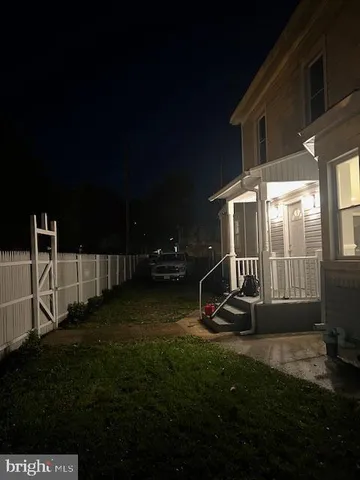 a view of swimming pool with an outdoor seating