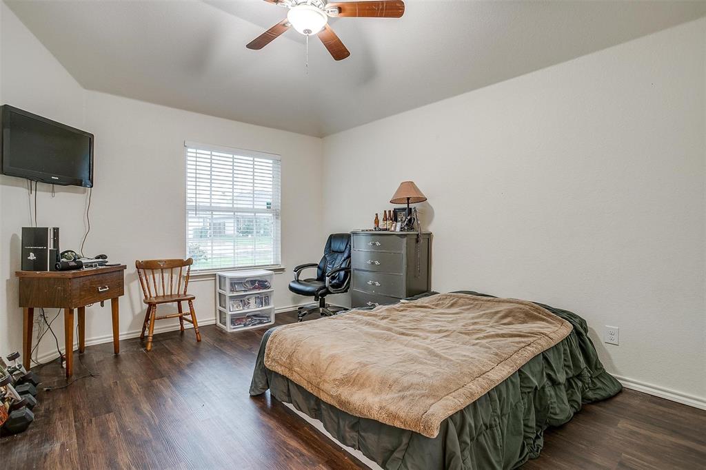 228 Lovers Path Drive Springtown, TX 76082 - Photo 30 of 40 Bedroom featuring ceiling fan, baseboards, and wood finished floors