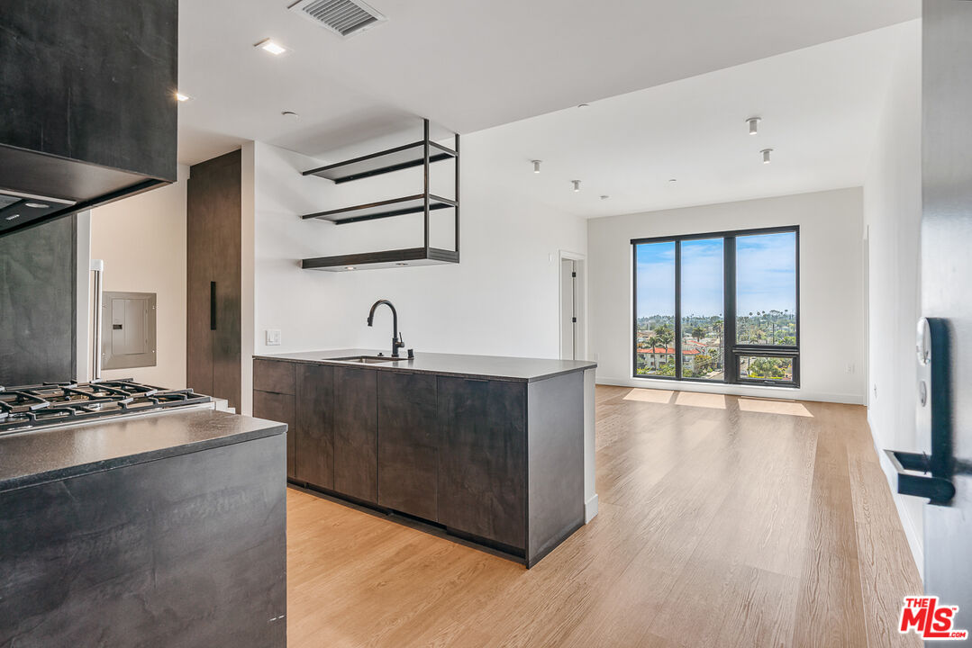 a kitchen with sink and cabinets
