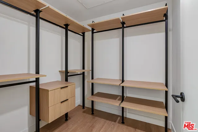 a bathroom with a shower and a mirror