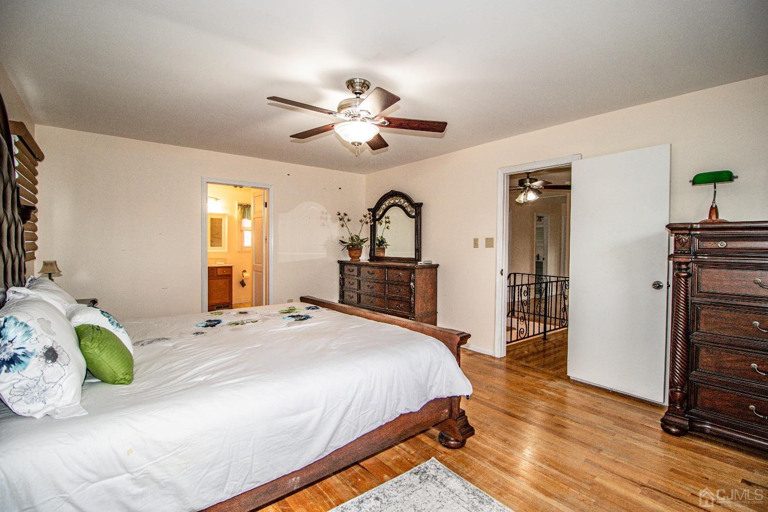 29 Devon Drive Piscataway, NJ 08854 - Photo 14 of 23 a bedroom with a bed and wooden floor