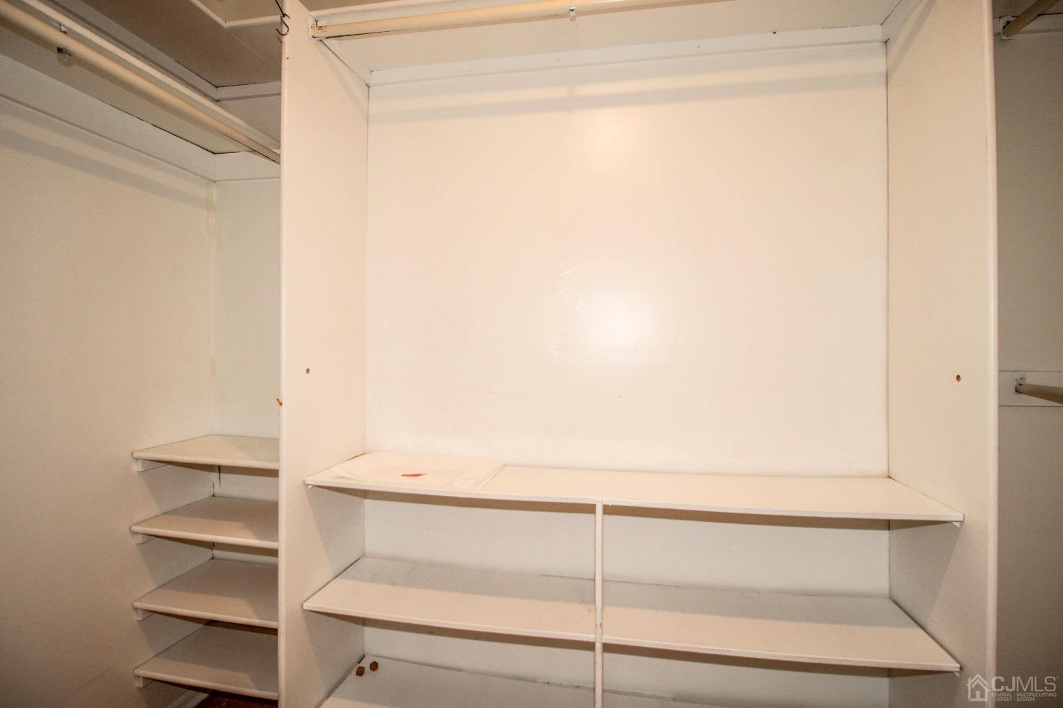 29 Devon Drive Piscataway, NJ 08854 - Photo 15 of 23 a view of walk in closet with empty racks