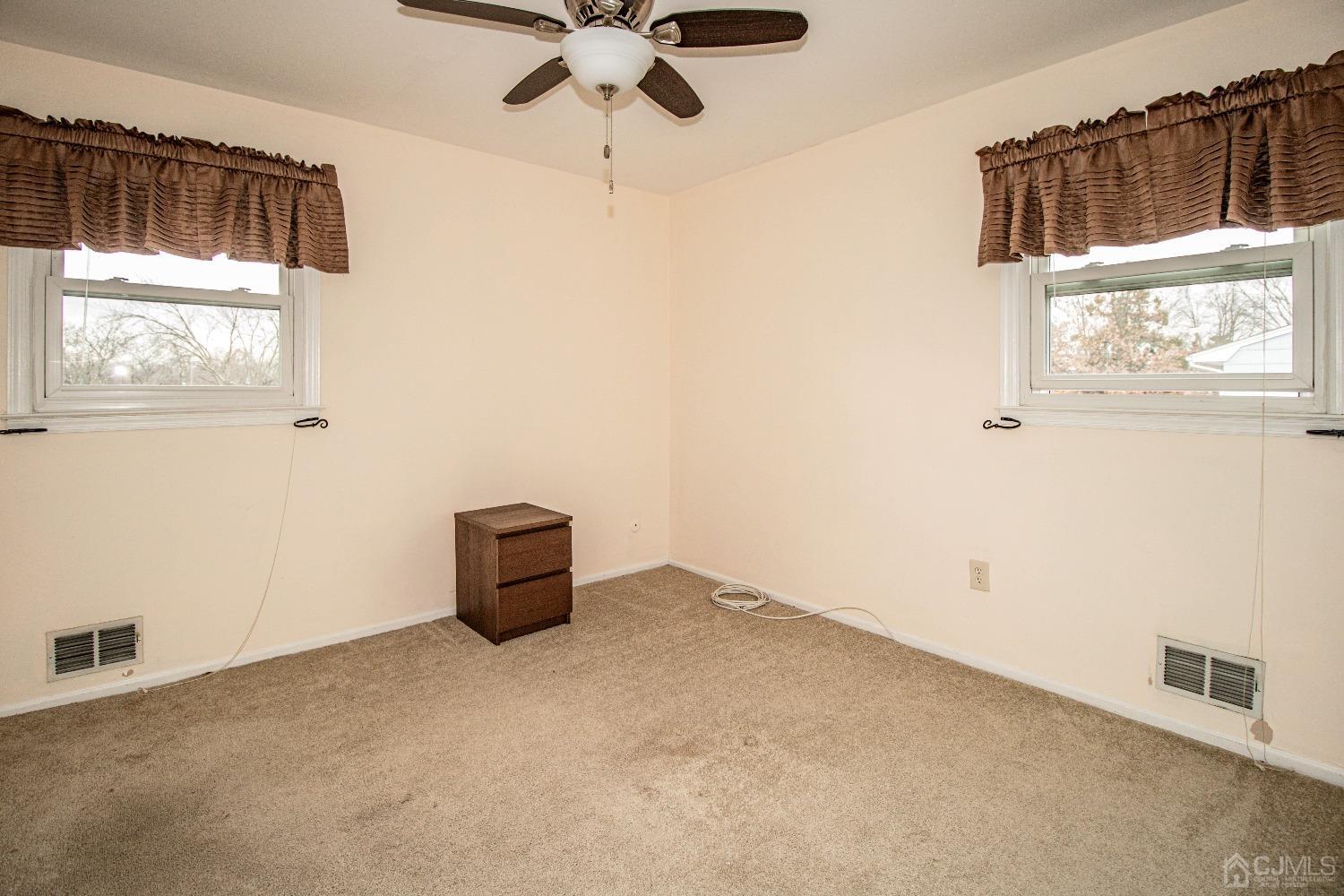29 Devon Drive Piscataway, NJ 08854 - Photo 19 of 23 en empty room with windows