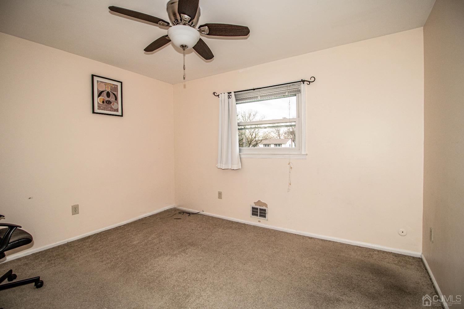 29 Devon Drive Piscataway, NJ 08854 - Photo 20 of 23 an empty room with windows and fan