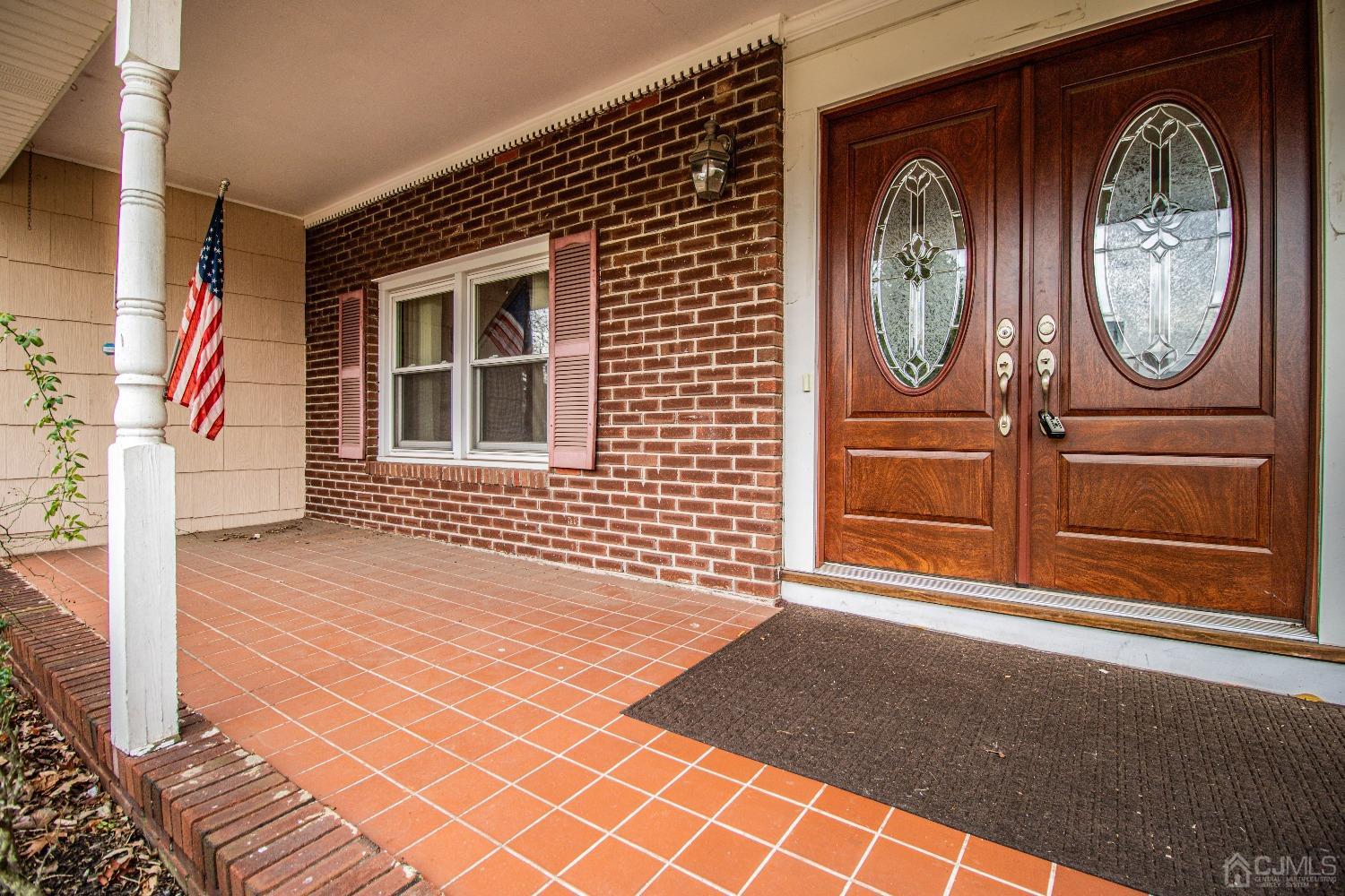 29 Devon Drive Piscataway, NJ 08854 - Photo 2 of 23 a front view of a house with a garden