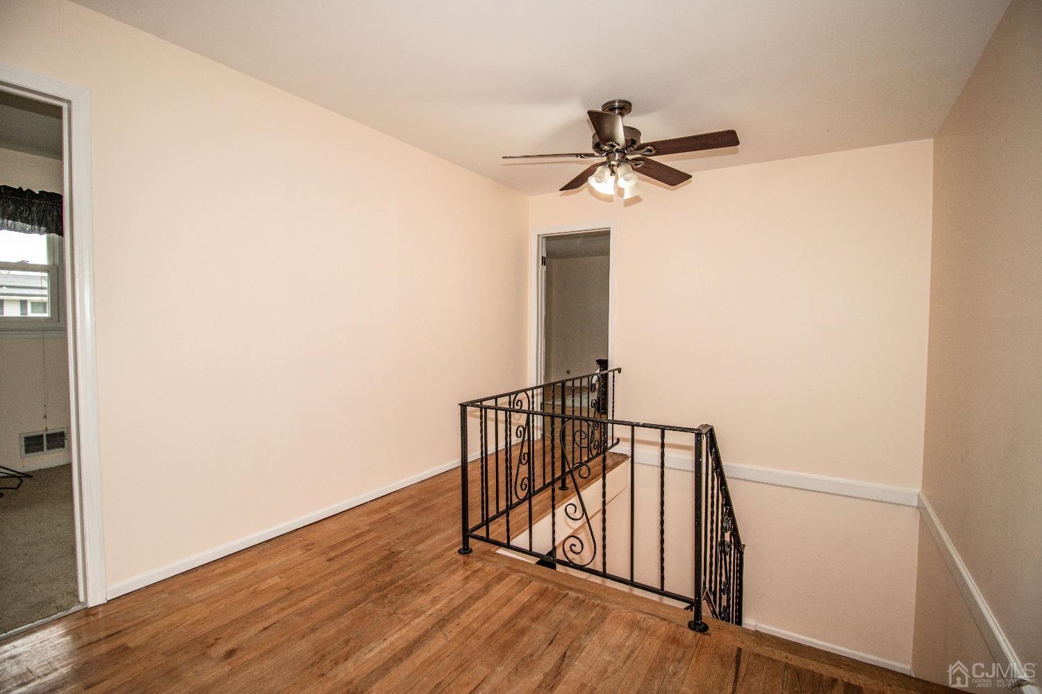 29 Devon Drive Piscataway, NJ 08854 - Photo 22 of 23 a view of hallway with wooden floor