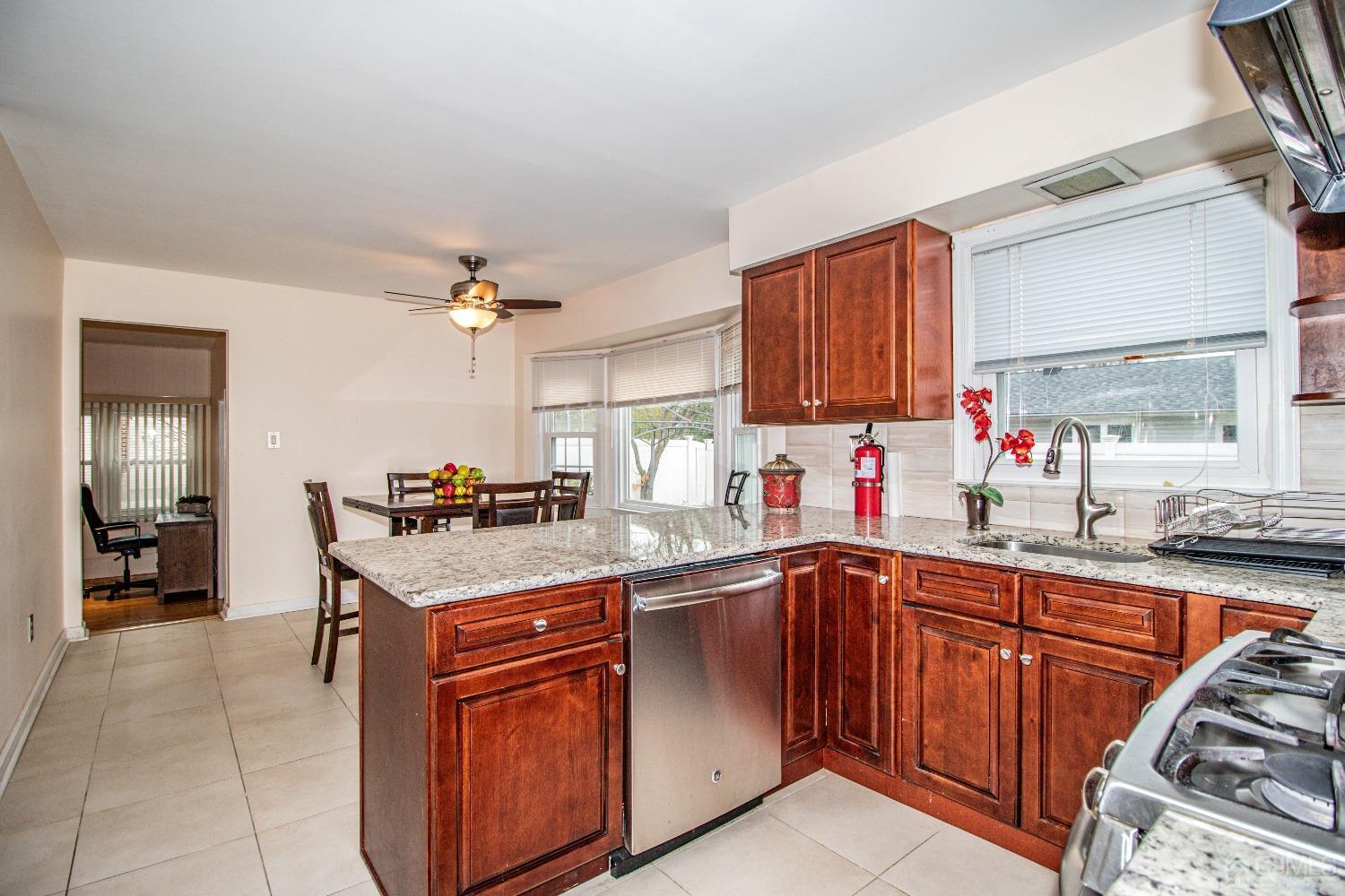 29 Devon Drive Piscataway, NJ 08854 - Photo 9 of 23 a kitchen with a sink stove and cabinets