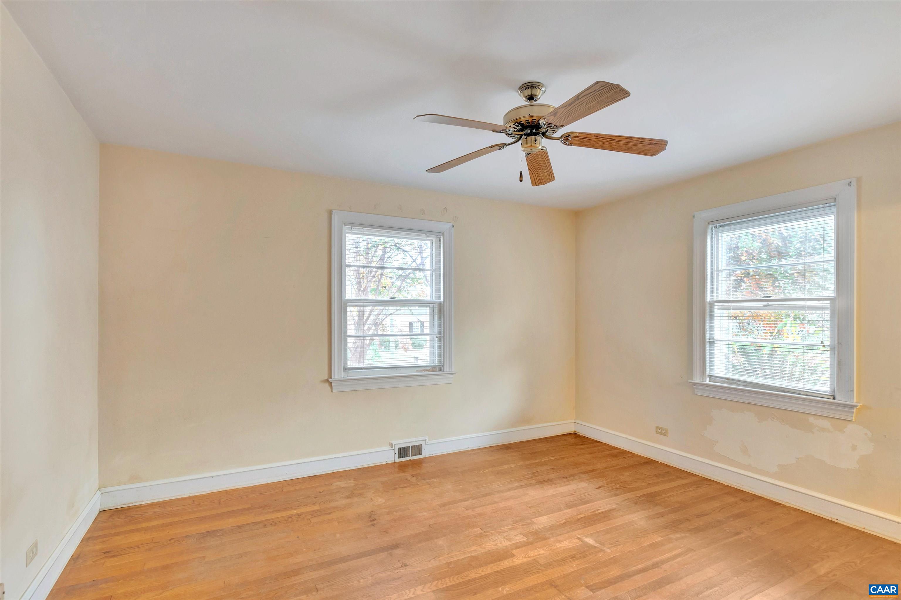 2026 Minor Road Charlottesville, VA 22903 - Photo 4 of 7 a view of an empty room with wooden floor and a window