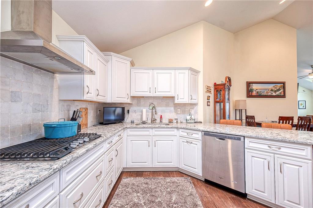 364 Saddlebrook Road Gibsonia, PA 15044 - Photo 13 of 39 Soft close drawers and cabinets, gas cook top, exhaust fan and quartz counter tops.