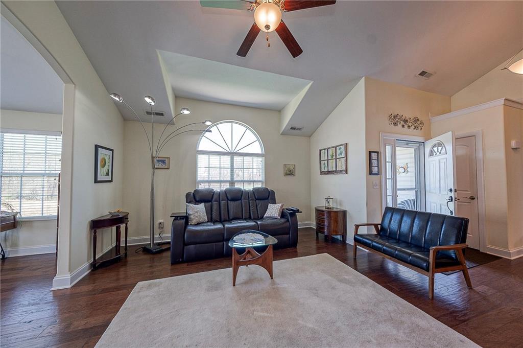 364 Saddlebrook Road Gibsonia, PA 15044 - Photo 7 of 39 Another view of your living room with a ceiling fan, vaulted ceiling and accented with a palladium window.