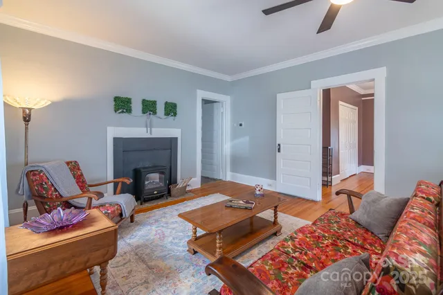 a bedroom with a bed and a fireplace