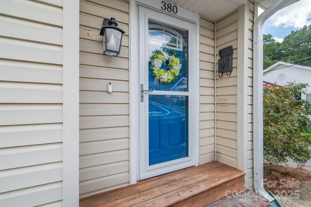 a view of front door and wooden door