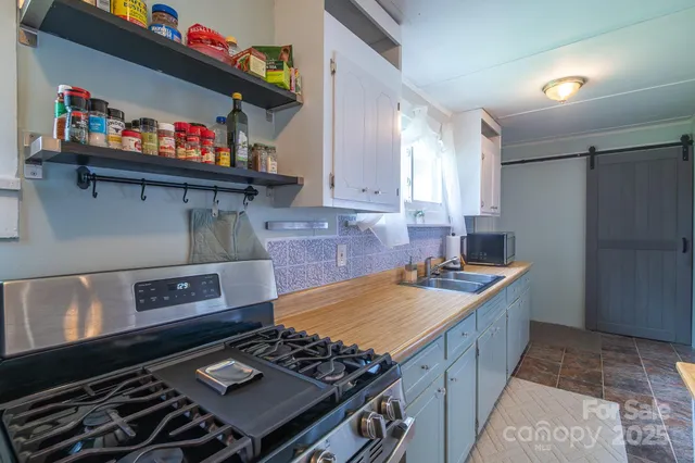 a kitchen with a stove and a refrigerator