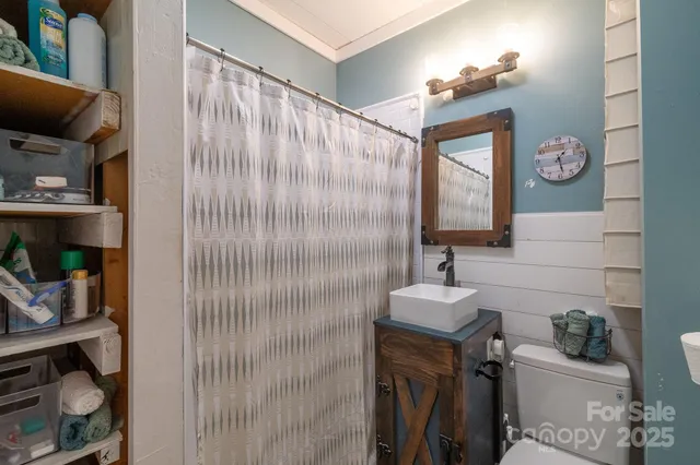 a bathroom with a sink toilet and vanity