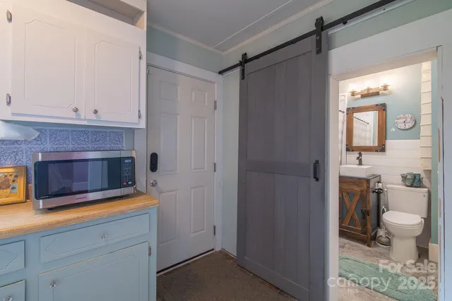 a living room with a fireplace and a wooden floor