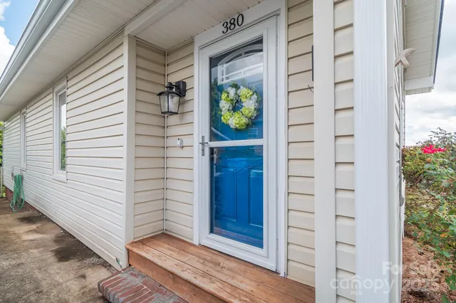 a view of house with backyard and garden