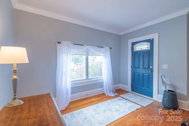a bedroom with a bed and a lamp on table