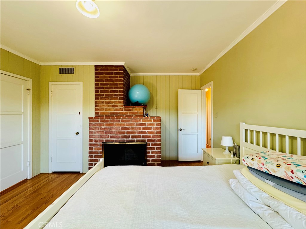 1777 La Cresta Drive Pasadena, CA 91103 - Photo 18 of 31 a bedroom with a bed and a chair