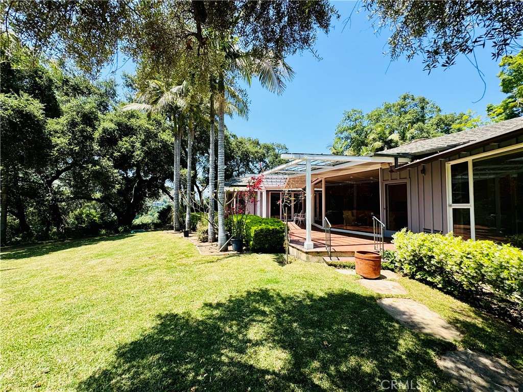 1777 La Cresta Drive Pasadena, CA 91103 - Photo 25 of 31 a front view of a house with garden and porch