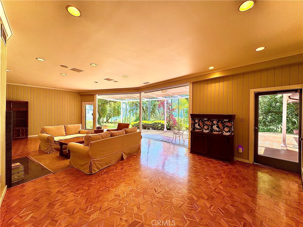 1777 La Cresta Drive Pasadena, CA 91103 - Photo 5 of 31 a living room with furniture and a floor to ceiling window