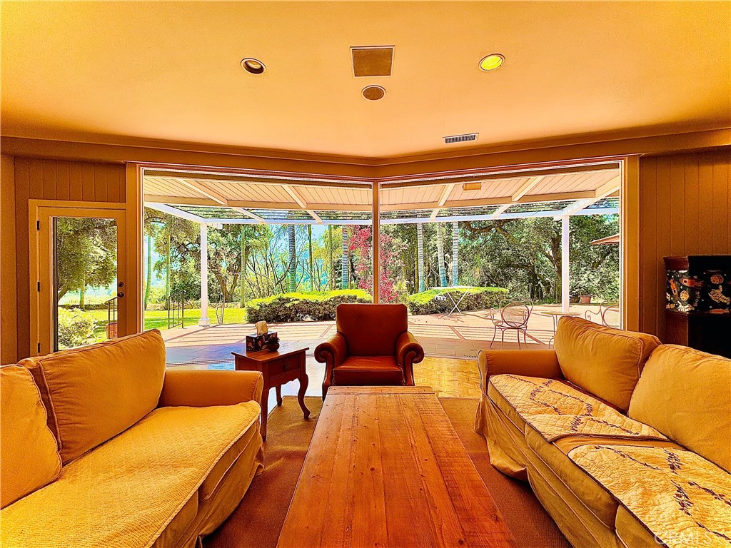 1777 La Cresta Drive Pasadena, CA 91103 - Photo 6 of 31 a living room with furniture and floor to ceiling windows