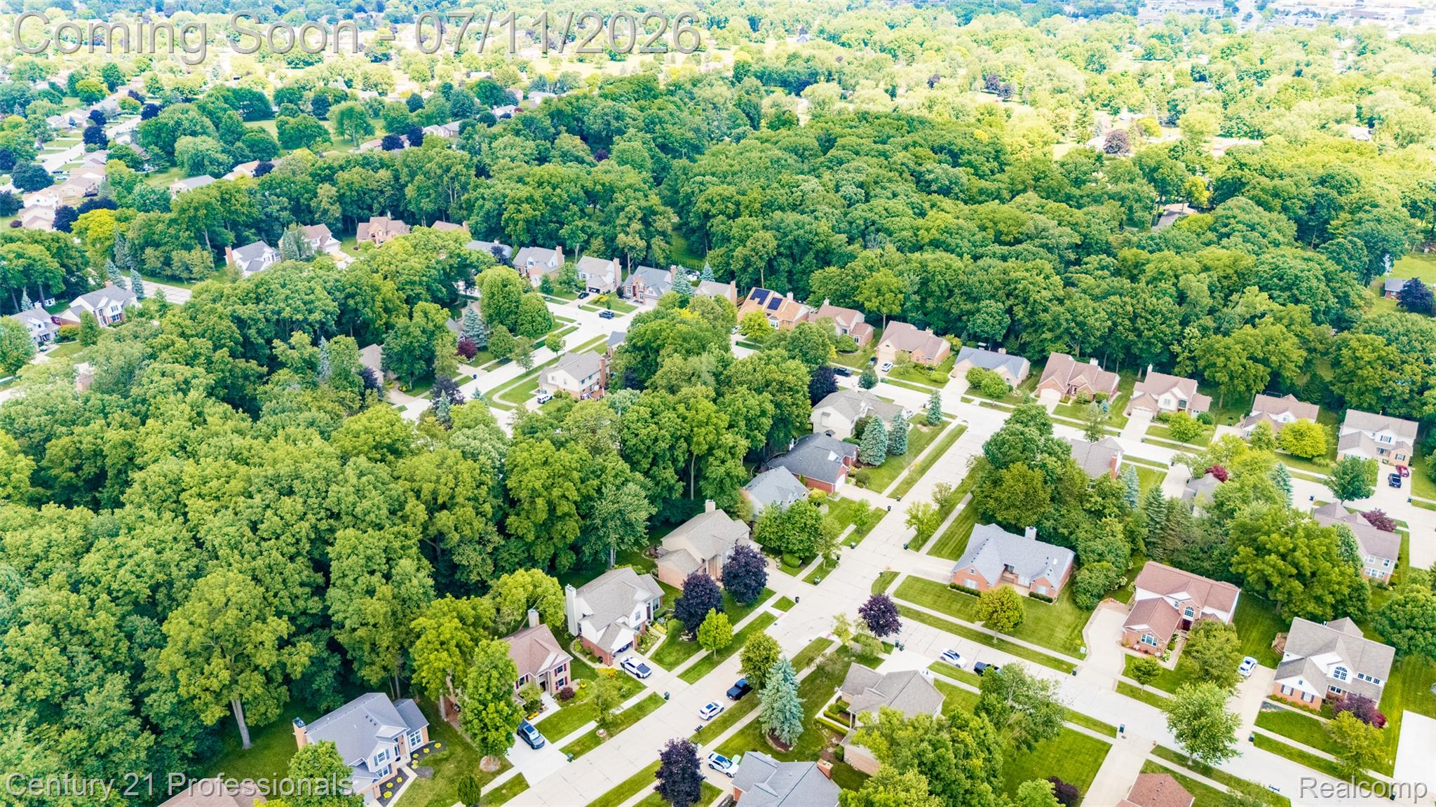 689 Woodfield Way Rochester, MI 48307 - Photo 56 of 61 Aerial panorama showcasing a residential community with abundant mature tree canopy