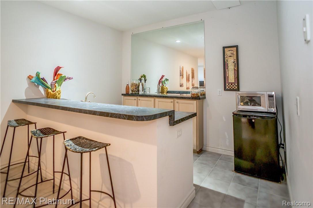 8433 Hyne Road Brighton, MI 48114 - Photo 26 of 39 Lower Level Wet Bar
