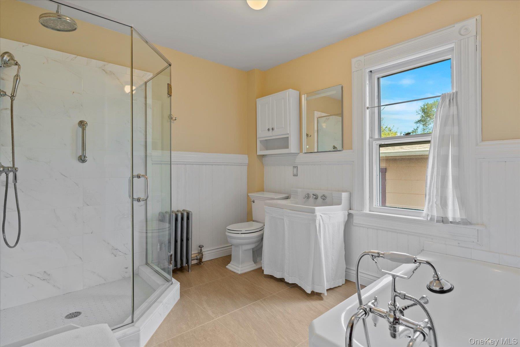 604 Main Street Greenport, NY 11944 - Photo 26 of 37 Full bathroom with shower and separate tub