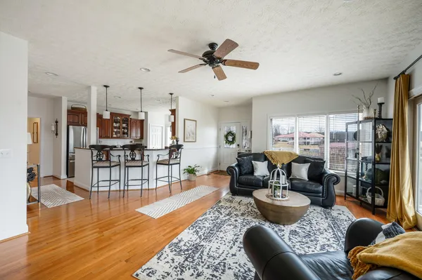 a view of a dining room with furniture and wooden floor