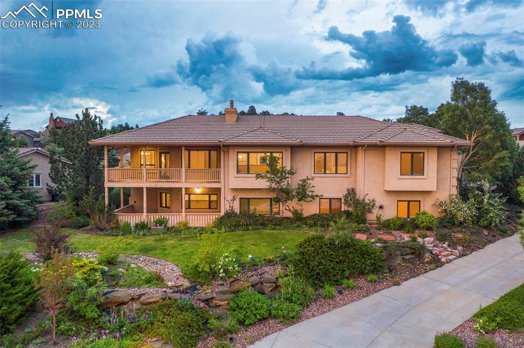 4120 Saddle Rock Road Colorado Springs, CO 80918 - Photo 1 of 50 a front view of a house with a garden