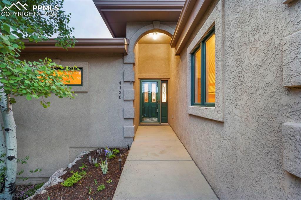 4120 Saddle Rock Road Colorado Springs, CO 80918 - Photo 12 of 50 a view of entryway with a front door and wooden floor