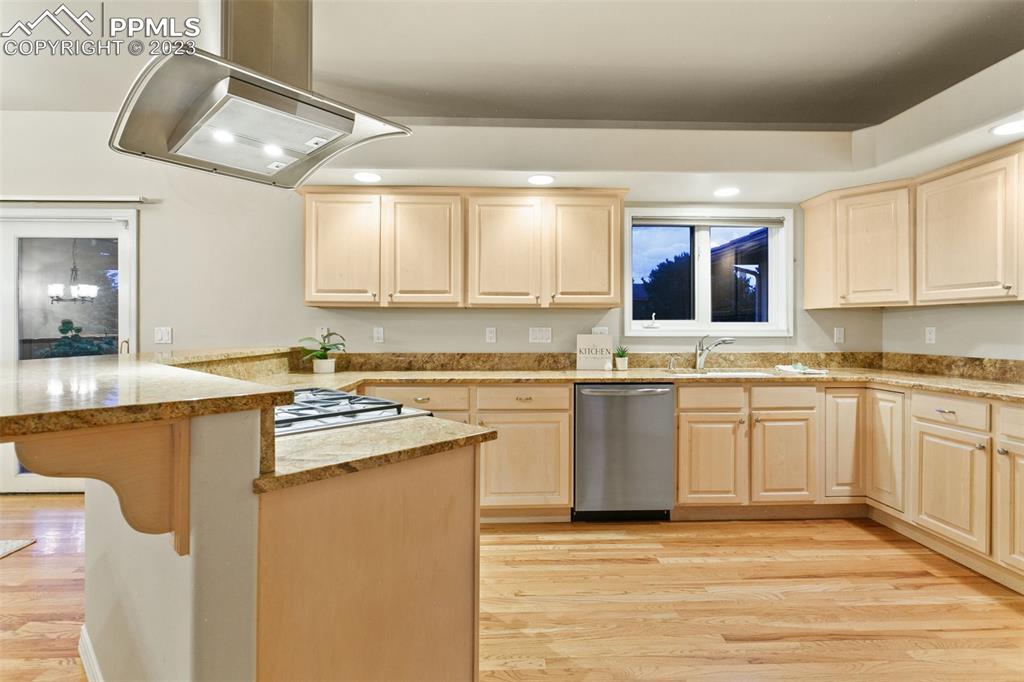 4120 Saddle Rock Road Colorado Springs, CO 80918 - Photo 27 of 50 a kitchen with stainless steel appliances granite countertop a sink stove and cabinets