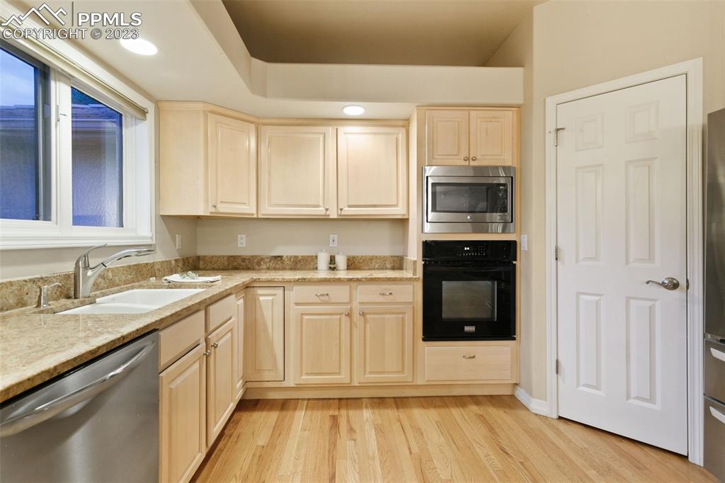4120 Saddle Rock Road Colorado Springs, CO 80918 - Photo 28 of 50 a kitchen with stainless steel appliances granite countertop a stove and a sink