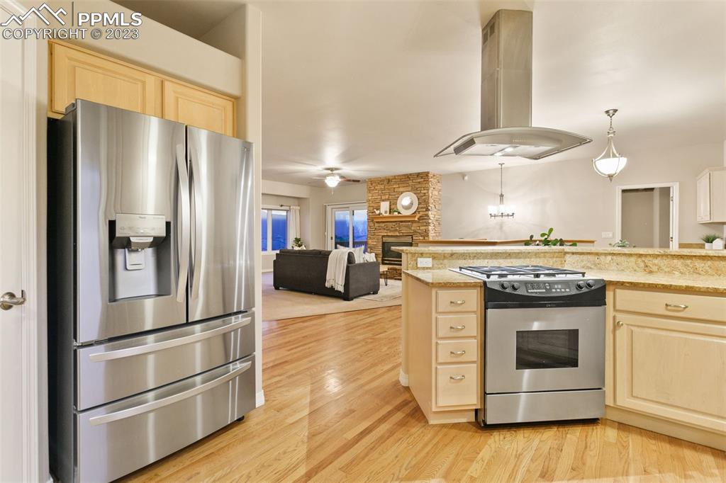 4120 Saddle Rock Road Colorado Springs, CO 80918 - Photo 29 of 50 a kitchen with stainless steel appliances granite countertop a refrigerator and a stove