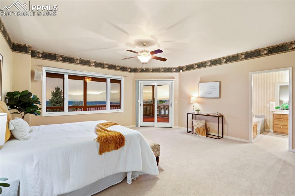 4120 Saddle Rock Road Colorado Springs, CO 80918 - Photo 31 of 50 a bed room with a bed and a large window