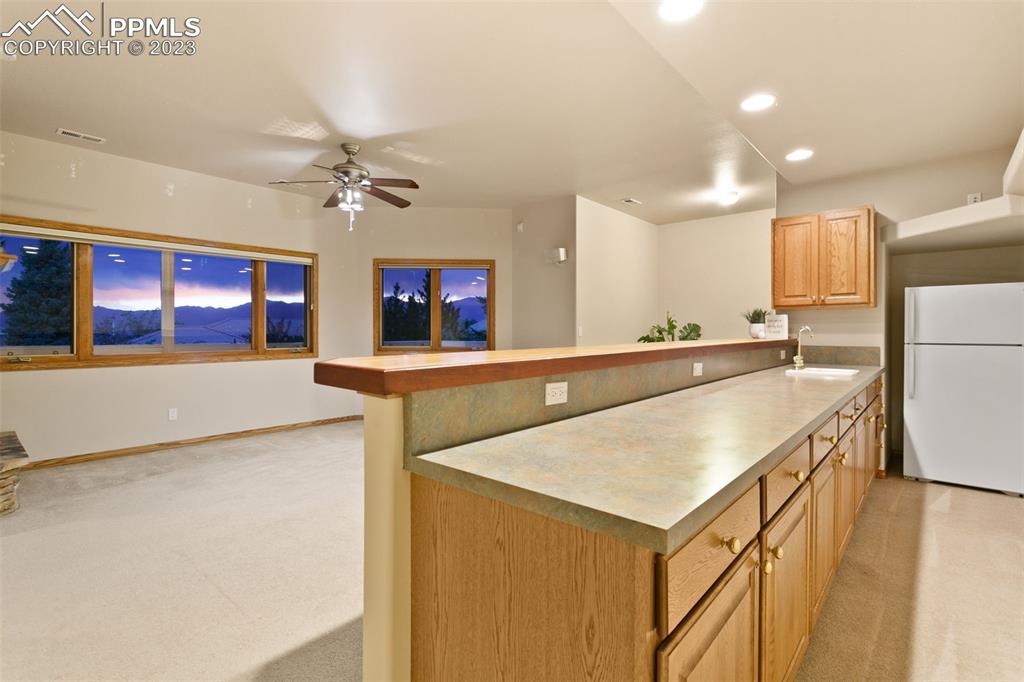 4120 Saddle Rock Road Colorado Springs, CO 80918 - Photo 42 of 50 a kitchen with stainless steel appliances a sink and a refrigerator