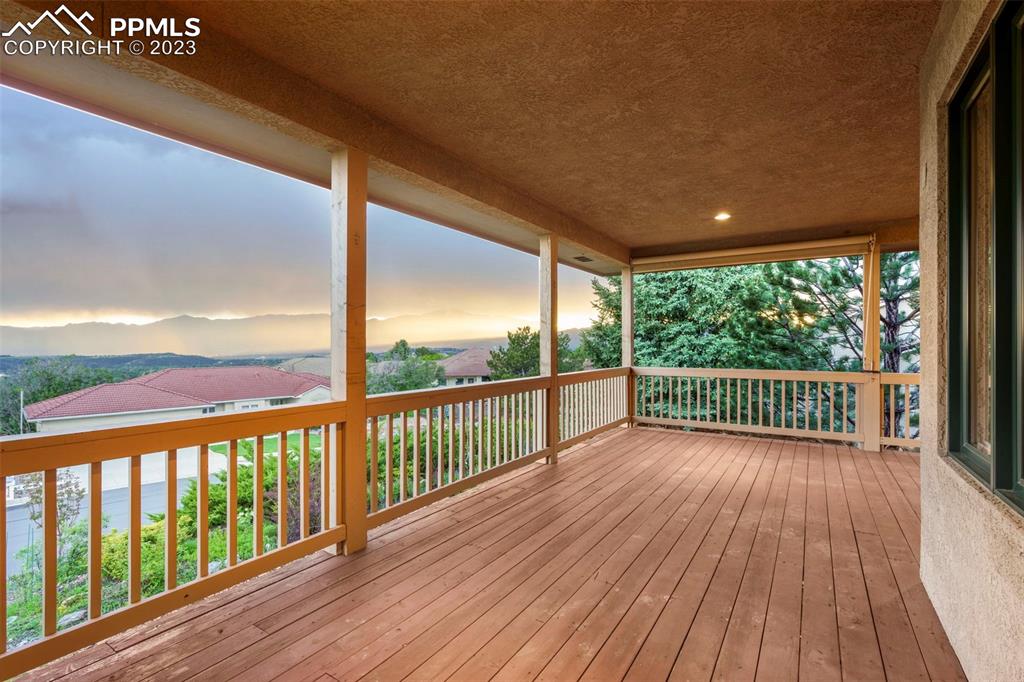 4120 Saddle Rock Road Colorado Springs, CO 80918 - Photo 47 of 50 a view of a wooden balcony with a yard