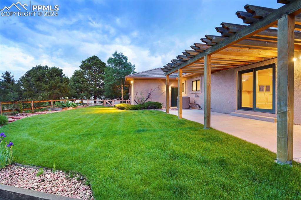 4120 Saddle Rock Road Colorado Springs, CO 80918 - Photo 48 of 50 a view of an house with backyard and a tree