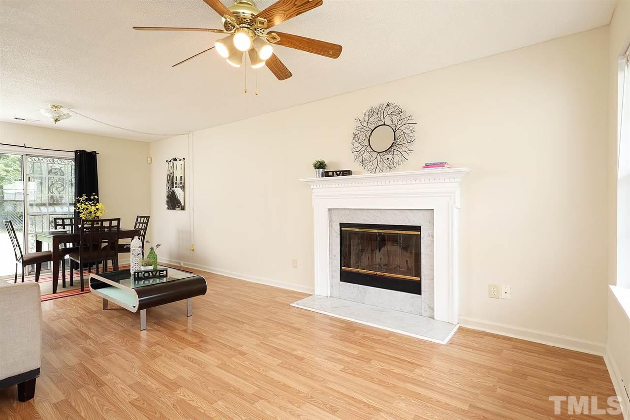 4103 Sudbury Road Durham, NC 27704 - Photo 6 of 24 Nice size living room with gas fireplace and dining room.