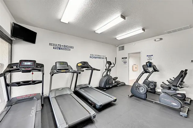 a view of a room with gym equipment